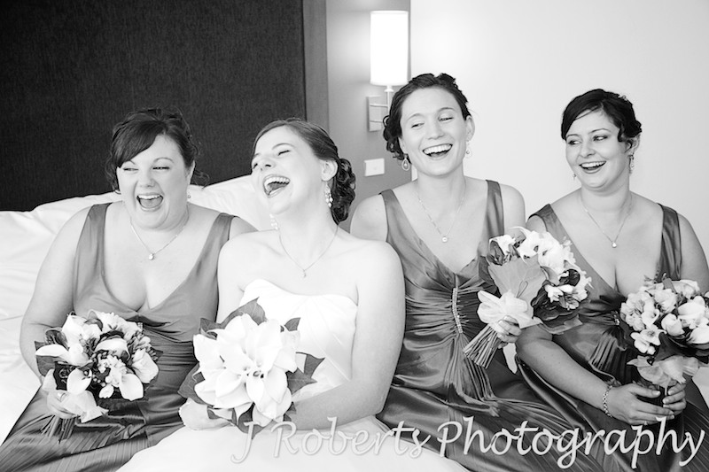 Bride laughing with her bridesmaids - wedding photography sydney